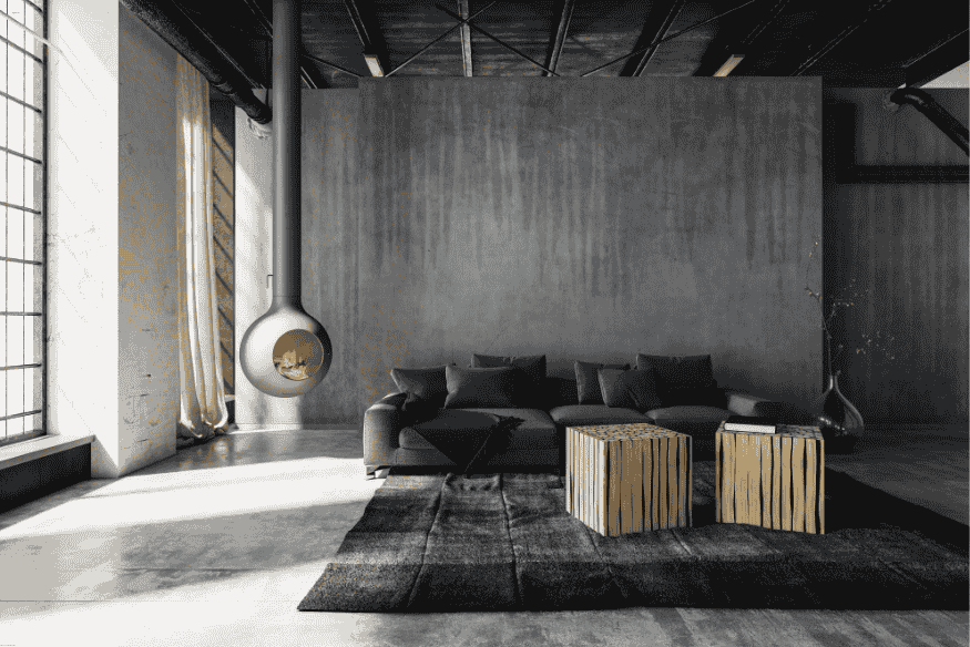 Sala industrial minimalista em cinza com lareira suspensa e mesas de centro de madeira.