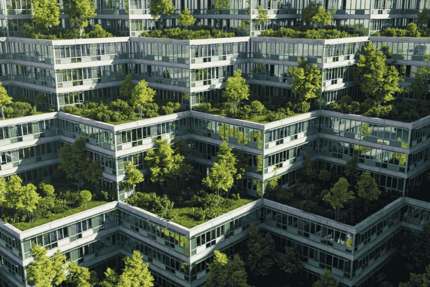Conjunto arquitetônico moderno com múltiplos terraços verdes e árvores plantadas.